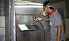 Spraying colour card in spray booth filter